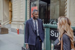 Get help buying a quality suit jacket from an Indiana Image Consultant image shows two people on sidewalk