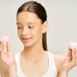Personal Image Consultant Beth Divine notes that tweens should not use adult skin care products image shows young girl holding pink containers