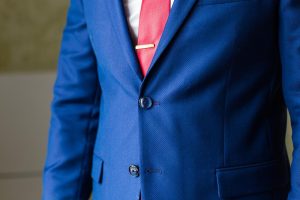 Select a suit right for you with tips from Indiana Personal Stylist Beth Divine image shows blue suit jacket and red tie