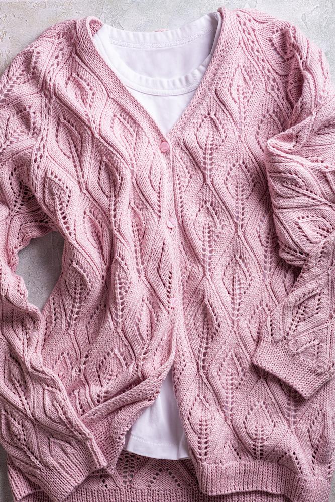 Bold colors and cardigans can help women dress triangle-shaped bodies according to Indiana Wardrobe Stylist Beth Divine image shows pink cardigan