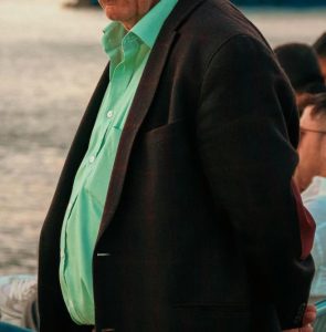 Contact Beth Divine for Indianapolis Men's Styling advice image shows man wearing green shirt