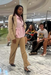 Work with Carmel Personal Stylist Beth Divine on your fall fashion image shows woman wearing pink blouse at fashion show