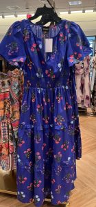 Identify flattering dresses with help from Carmel Wardrobe Stylist Beth Divine image shows purple midi dress on hanger